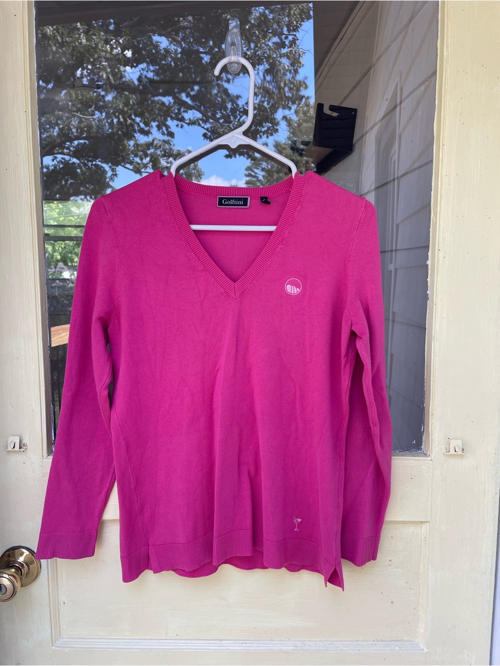 Golftini Women's V-Neck Sweater in Fuchsia Pink. Cliffs logo on chest
